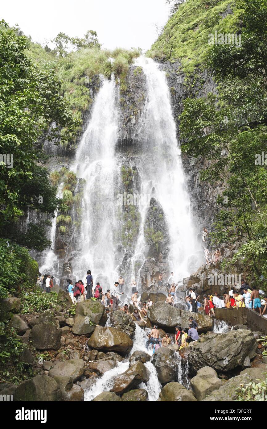 Popular waterfall of Amboli Ghat tourist bathing ; Sawantwadi to Amboli Hill station ; Maharashtra ; India Stock Photo