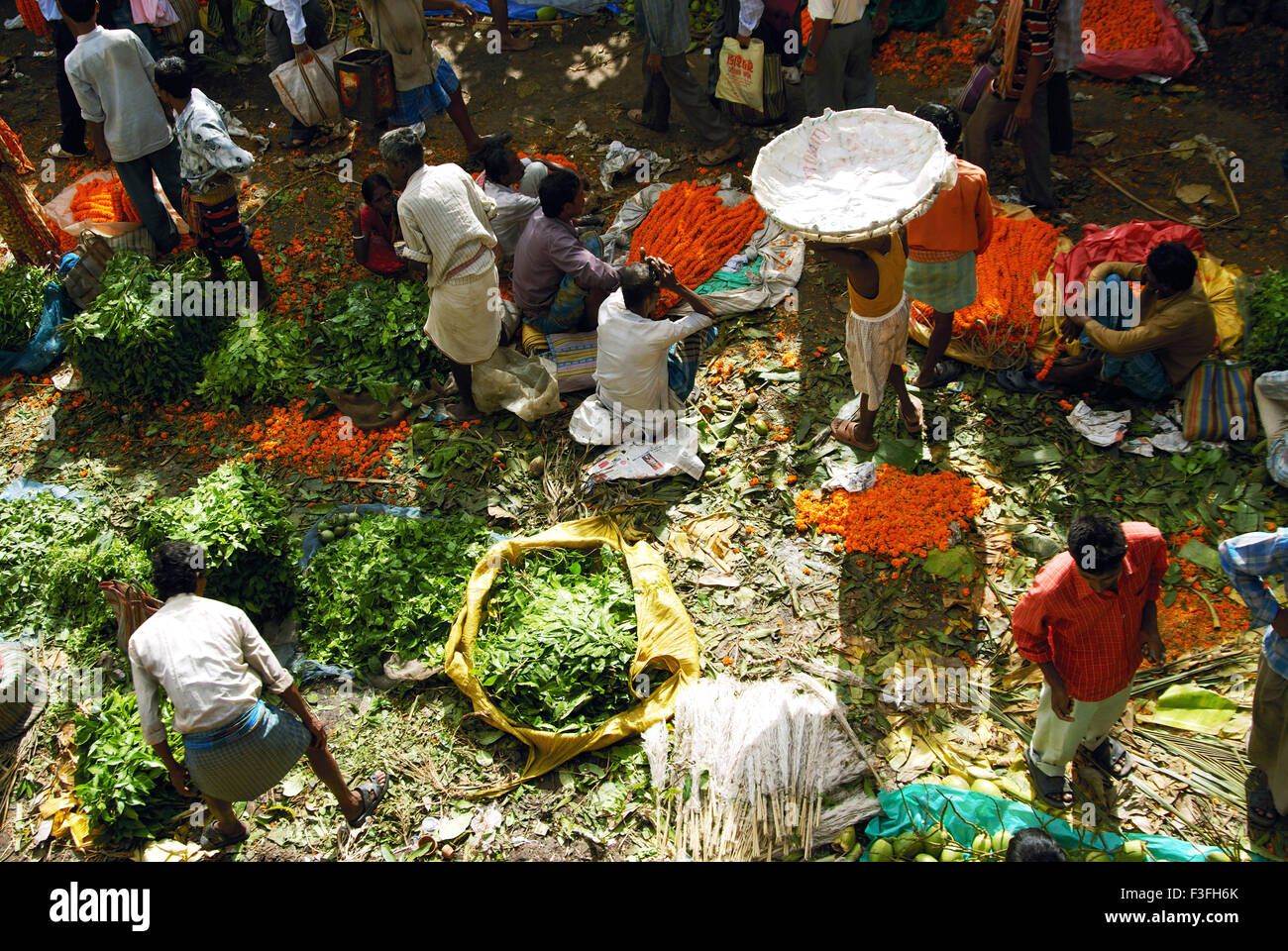 Cut flowers are sold at Howrah Bridge ; Calcutta ; West Bengal ; India Stock Photo