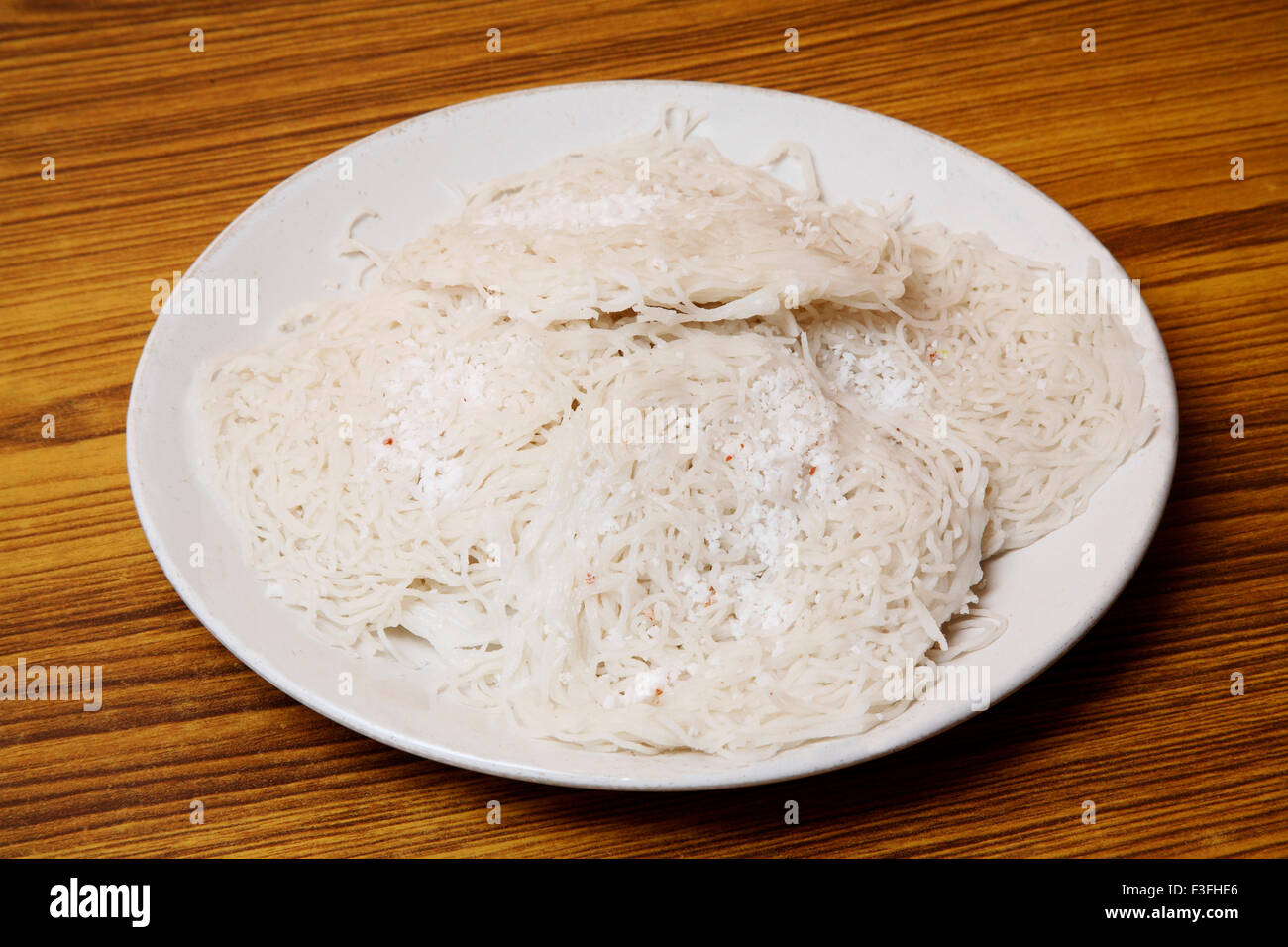 Vegetarian ; South Indian Food ; freshly made rice noodles Idiappam ; Kerala ; India Stock Photo