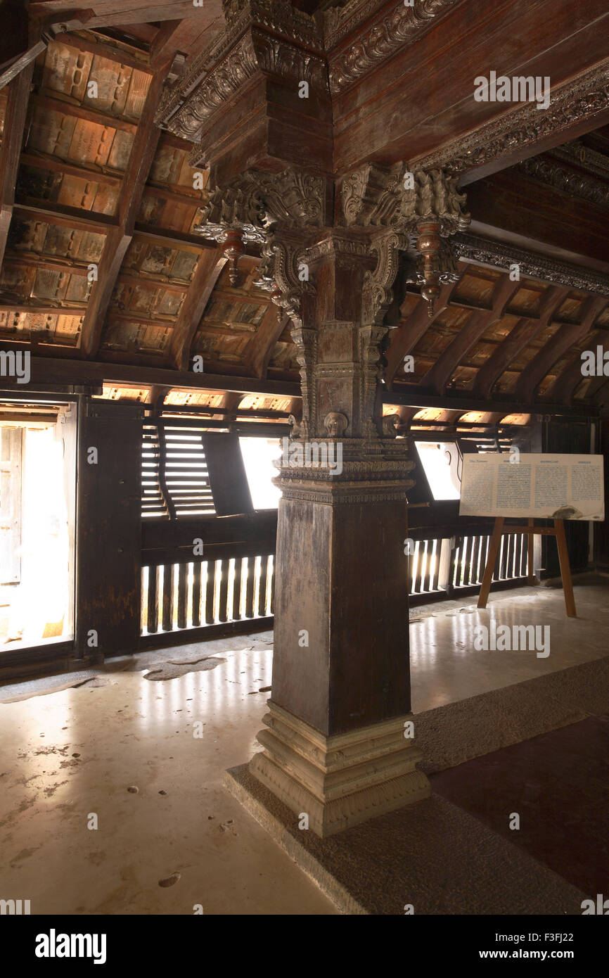 Carved jackfruit Wood Pillars in Thai Kottaram ; Mother's Palace in Padmanabhapuram Wooden Palace ; Tamil Nadu ; India Stock Photo
