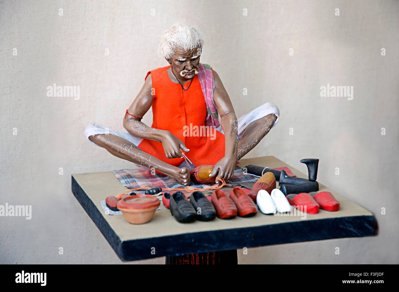 Cobbler ; Terra Cotta Art at trade fair ; Bombay Mumbai ; Maharashtra ; India ; Asia Stock Photo