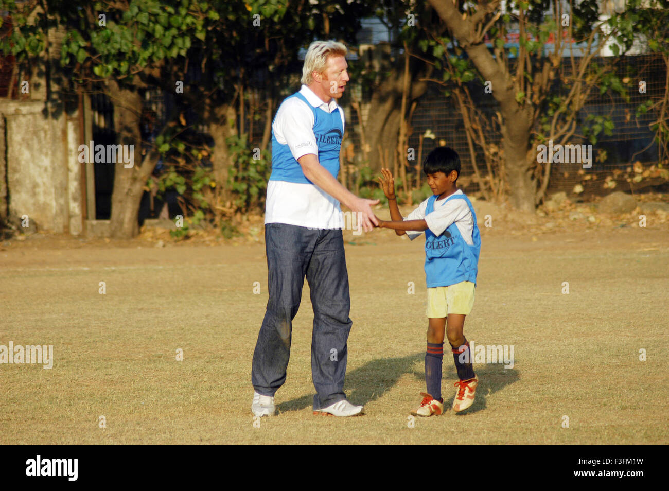 Boris Franz Becker visits a football program organized by an NGO Magic Bus in Bombay now Mumbai ; Maharashtra ; India NO MR Stock Photo