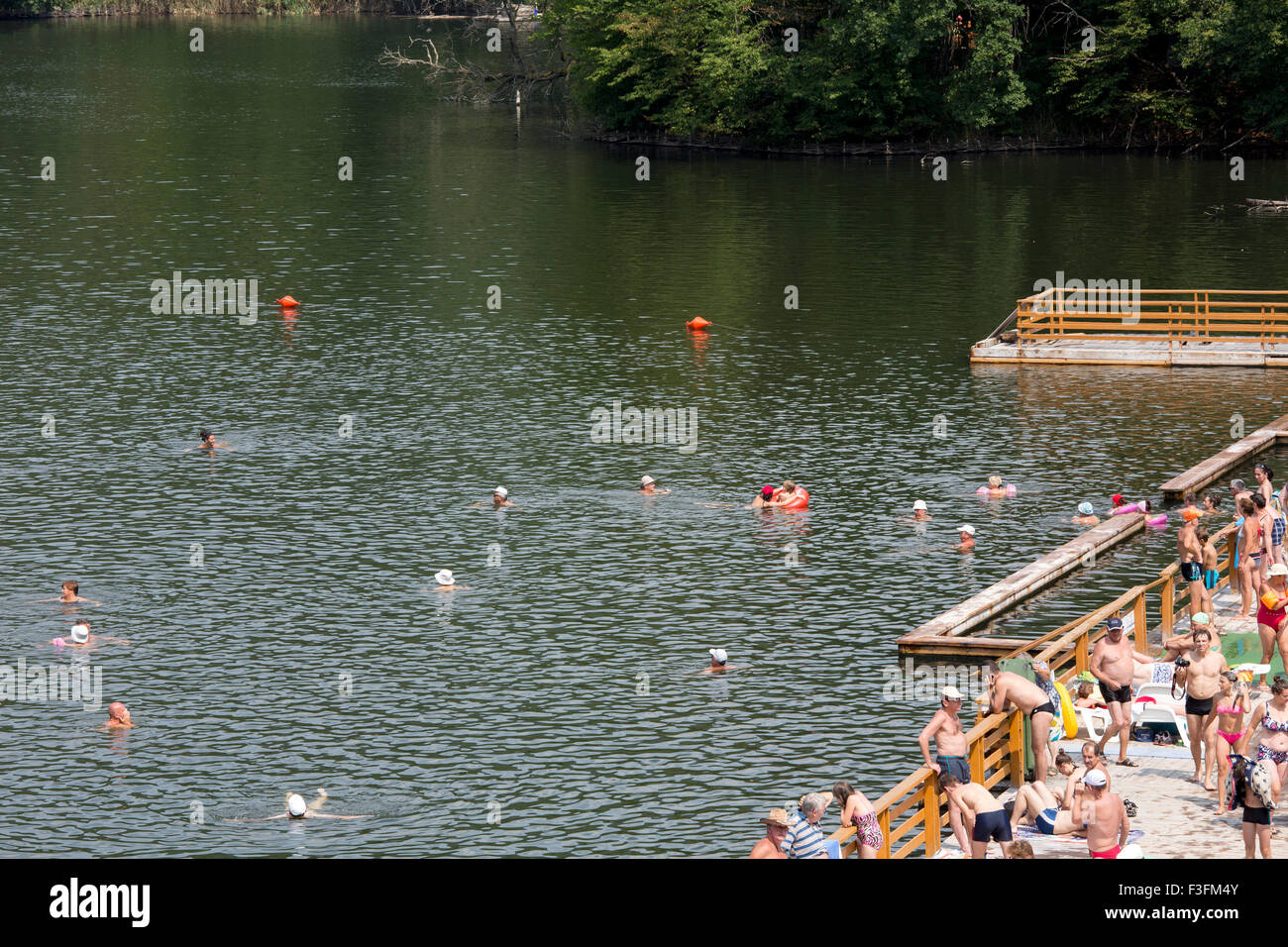 Crowd of people at the Bear Lake (Lacu Ursu) in Sovata, Transylvania, Romania Stock Photo