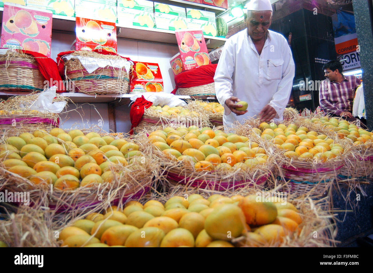 A fruit seller sells Alphonso mangoes at Crawford Market in Bombay now