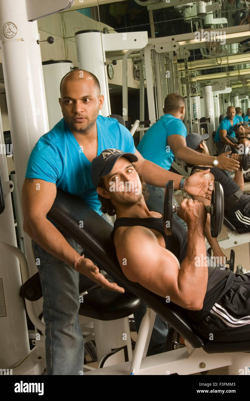 Hrithik Roshan, Indian bollywood hindi movie film actor with gym trainer Satya, Satyajit Chaurasia, India, Asia Stock Photo
