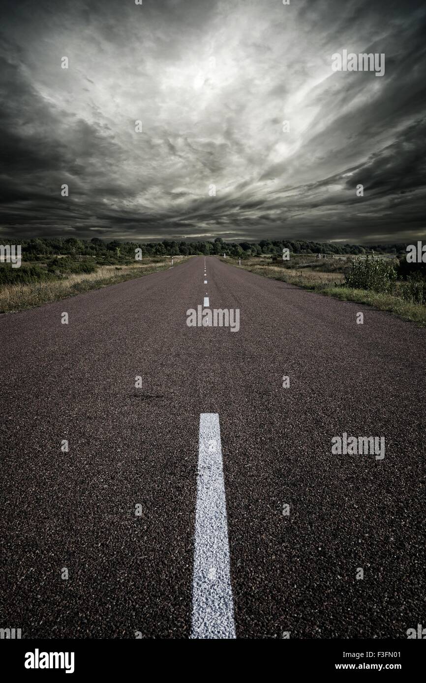 Road and a stormy sky Stock Photo - Alamy