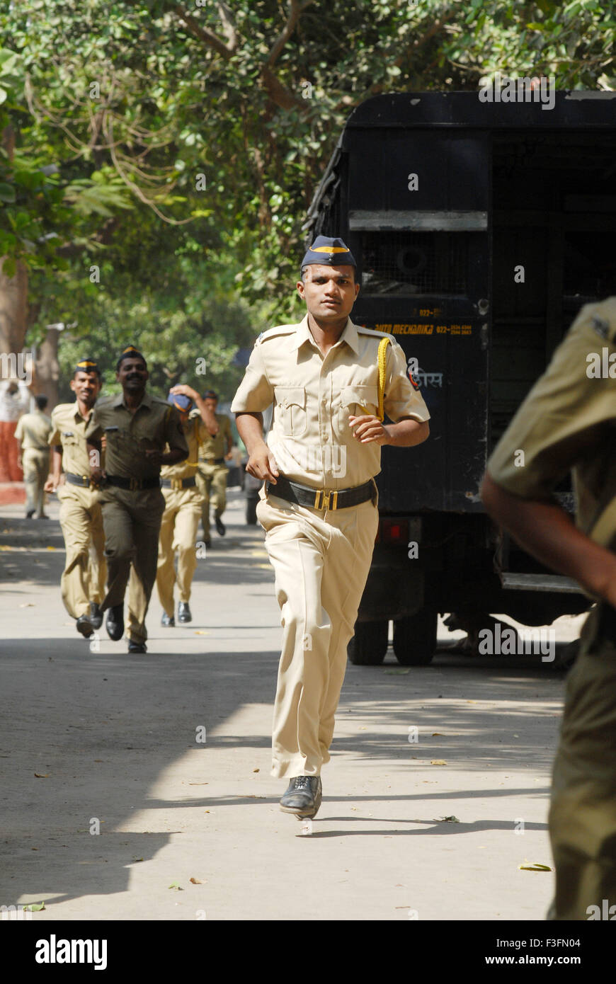 Mumbai police constables are running to attend the meditation camp ; Bombay now Mumbai ; Maharashtra ; India NO MR Stock Photo