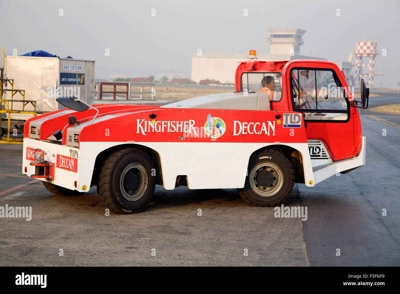Push back vehicle of king fisher deccan ltd. at run way ; Chattrapati Shivaji Terminal ; Santacruz Mumbai Stock Photo