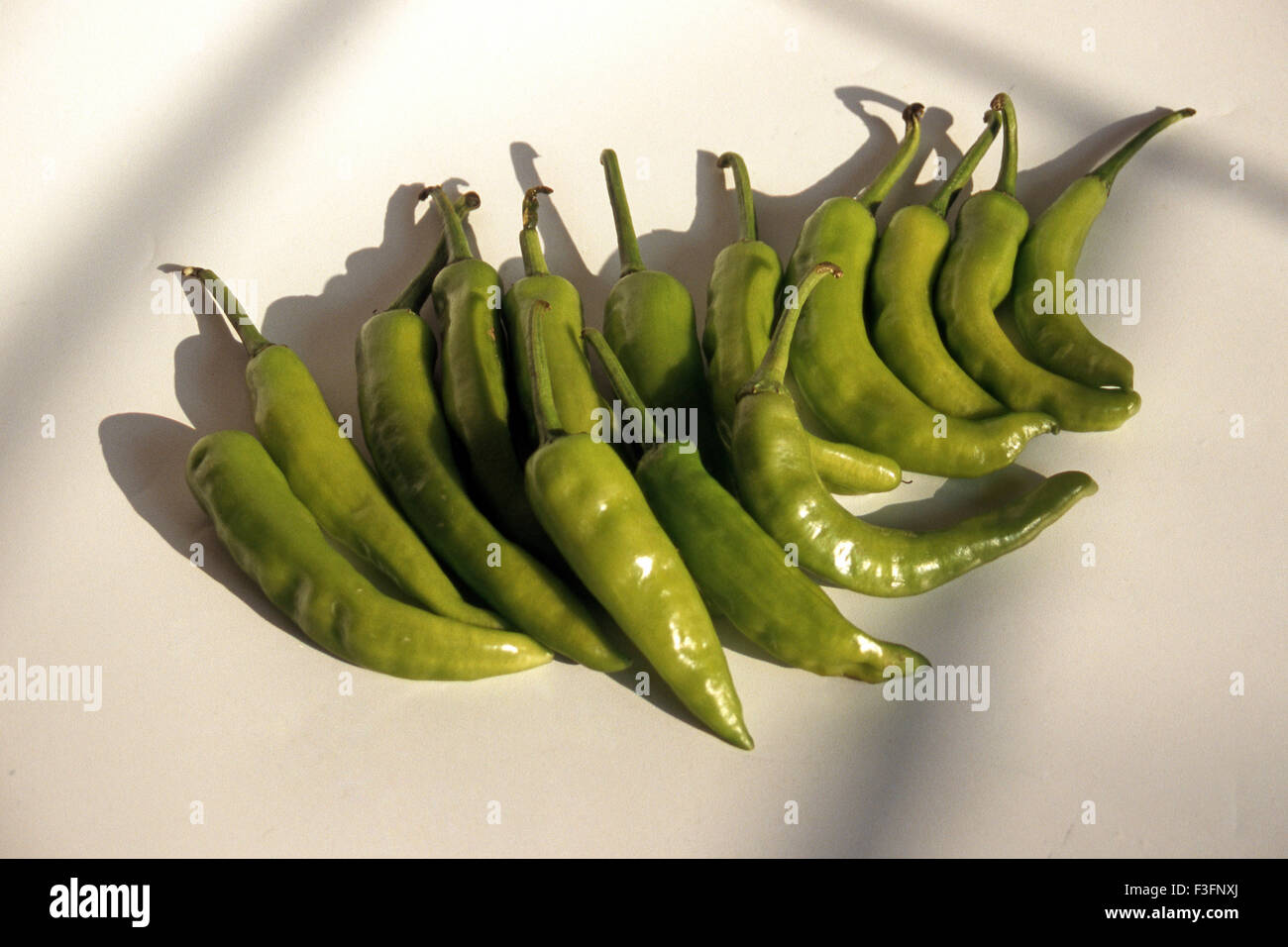 Green chillies on white background Stock Photo