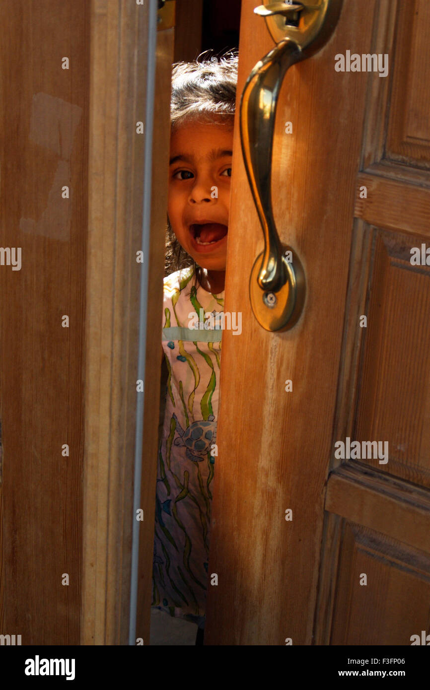 Two years old child trying to get in MR#0543 Stock Photo