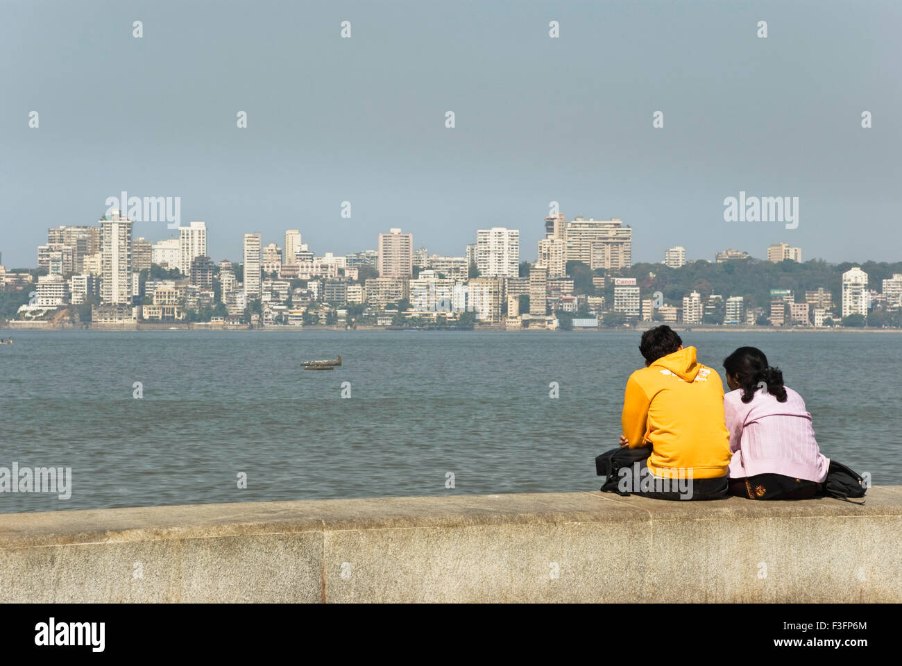 Couple enjoying sea view at Marine Drive ; Marine Lines ; Bombay now
