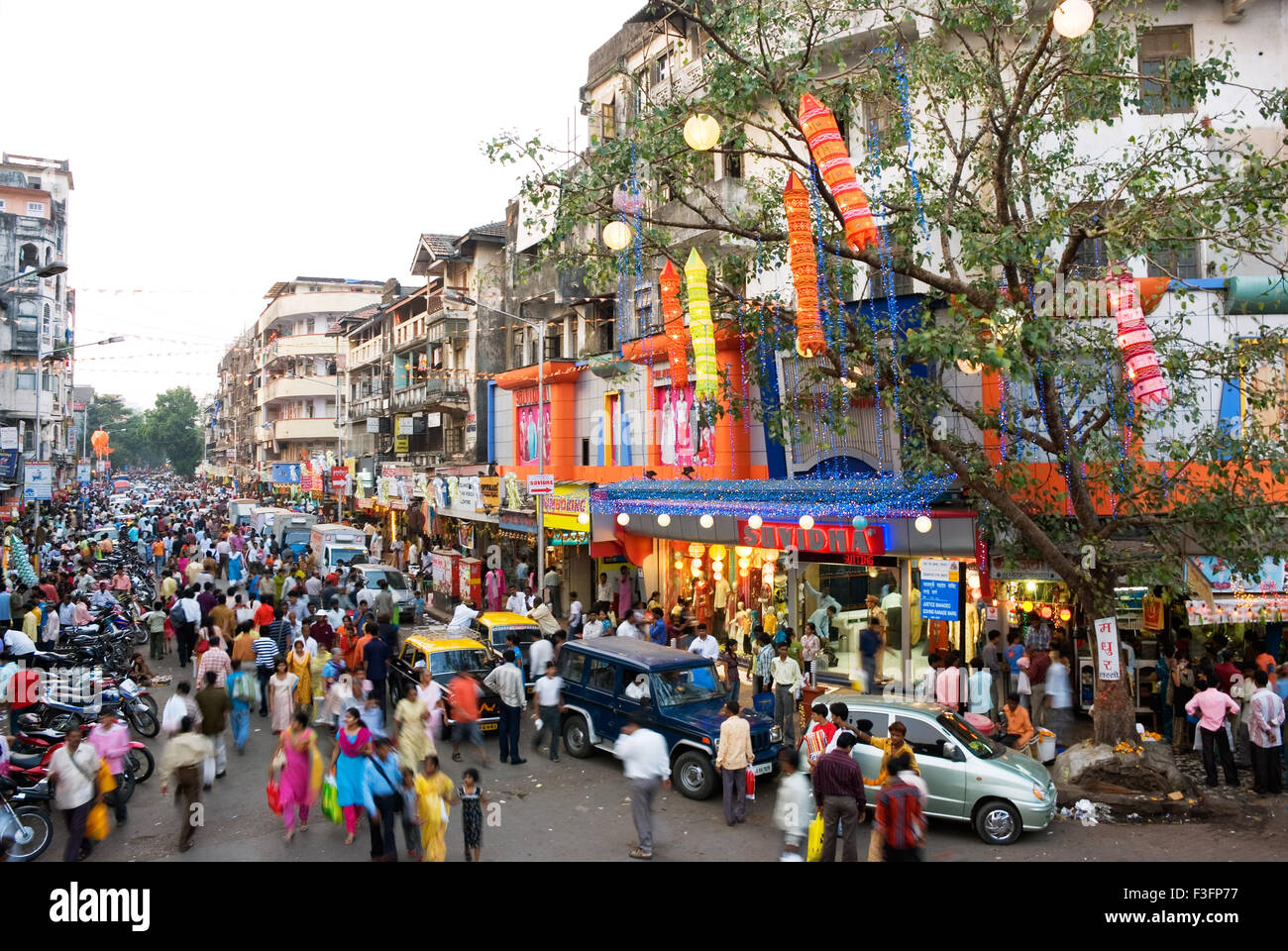 People shopping for Diwali festival on a street in Dadar ; Bombay now