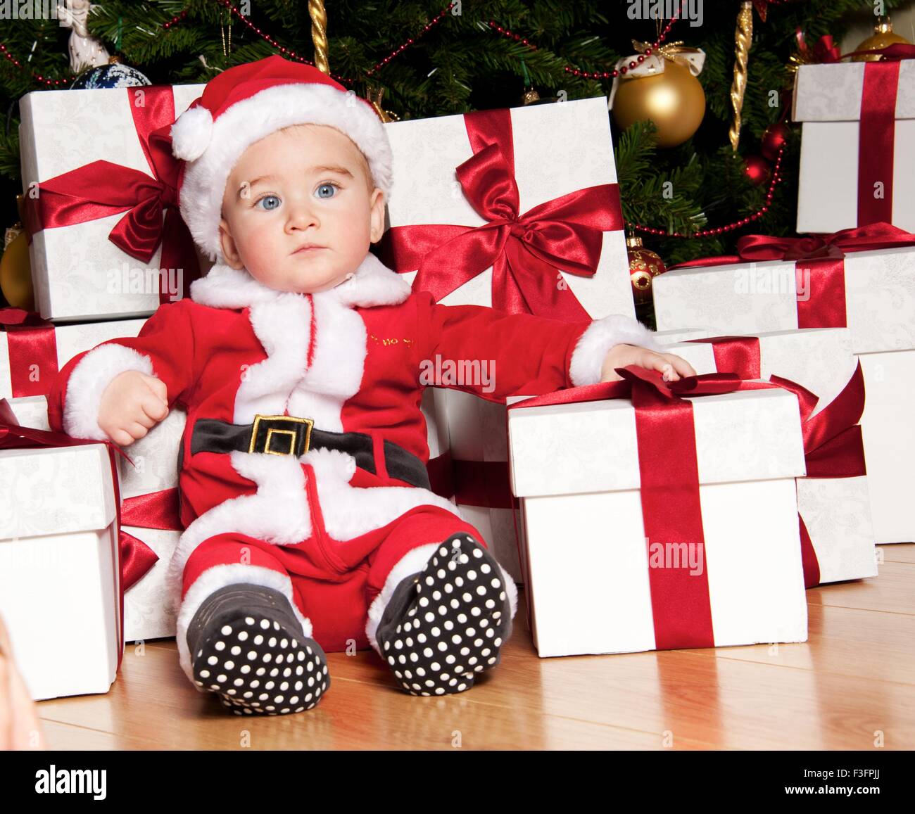 Little boy with a gift boxes Stock Photo - Alamy