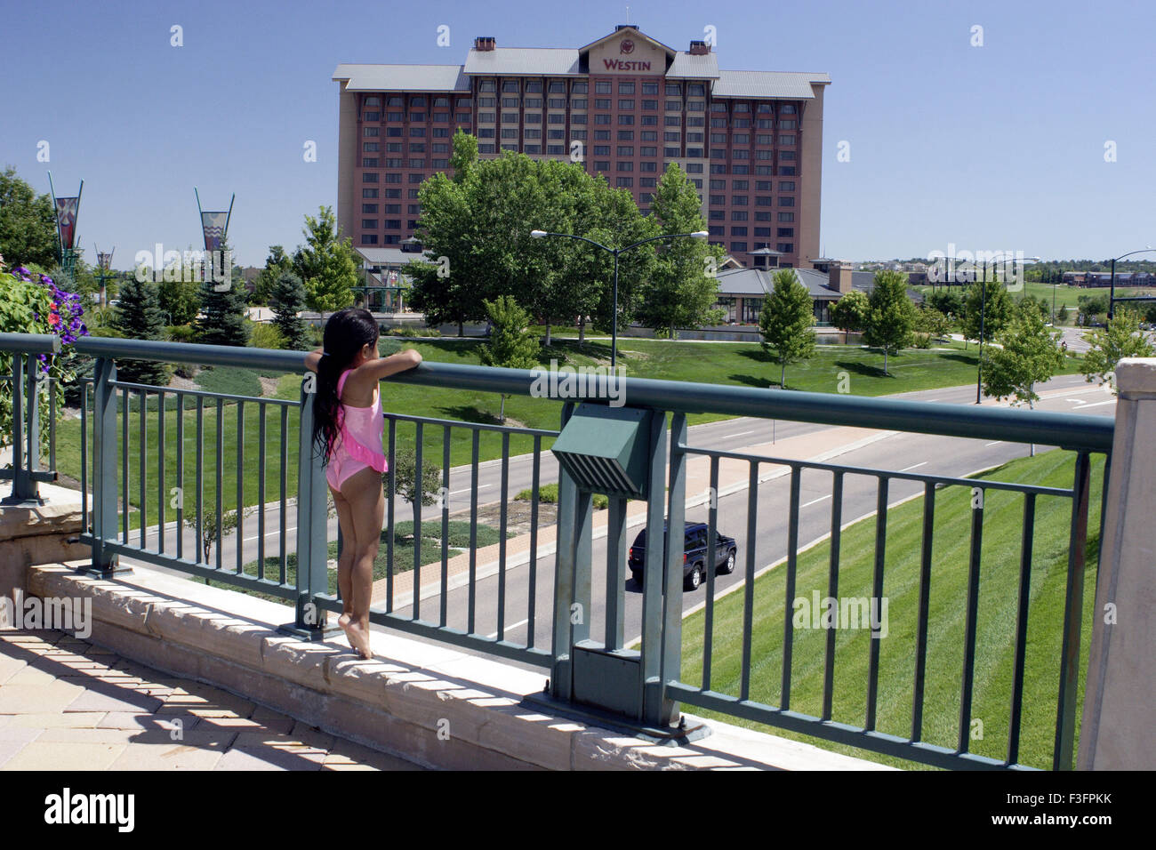 Four year old girl enjoying view from over bridge near fountain ; Denver ; U.S.A United States of America Stock Photo