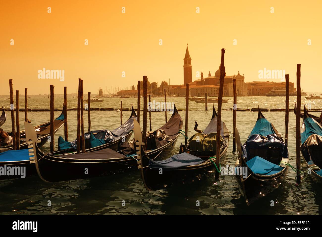 Gondolas against Venice panorama Stock Photo - Alamy