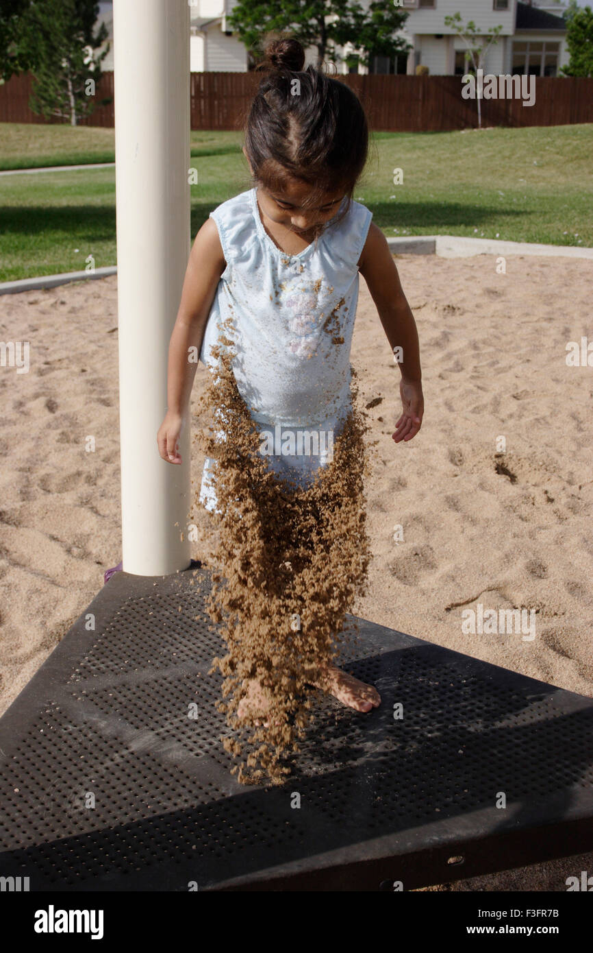 Three years old girl playing with sand MR#0543 Stock Photo