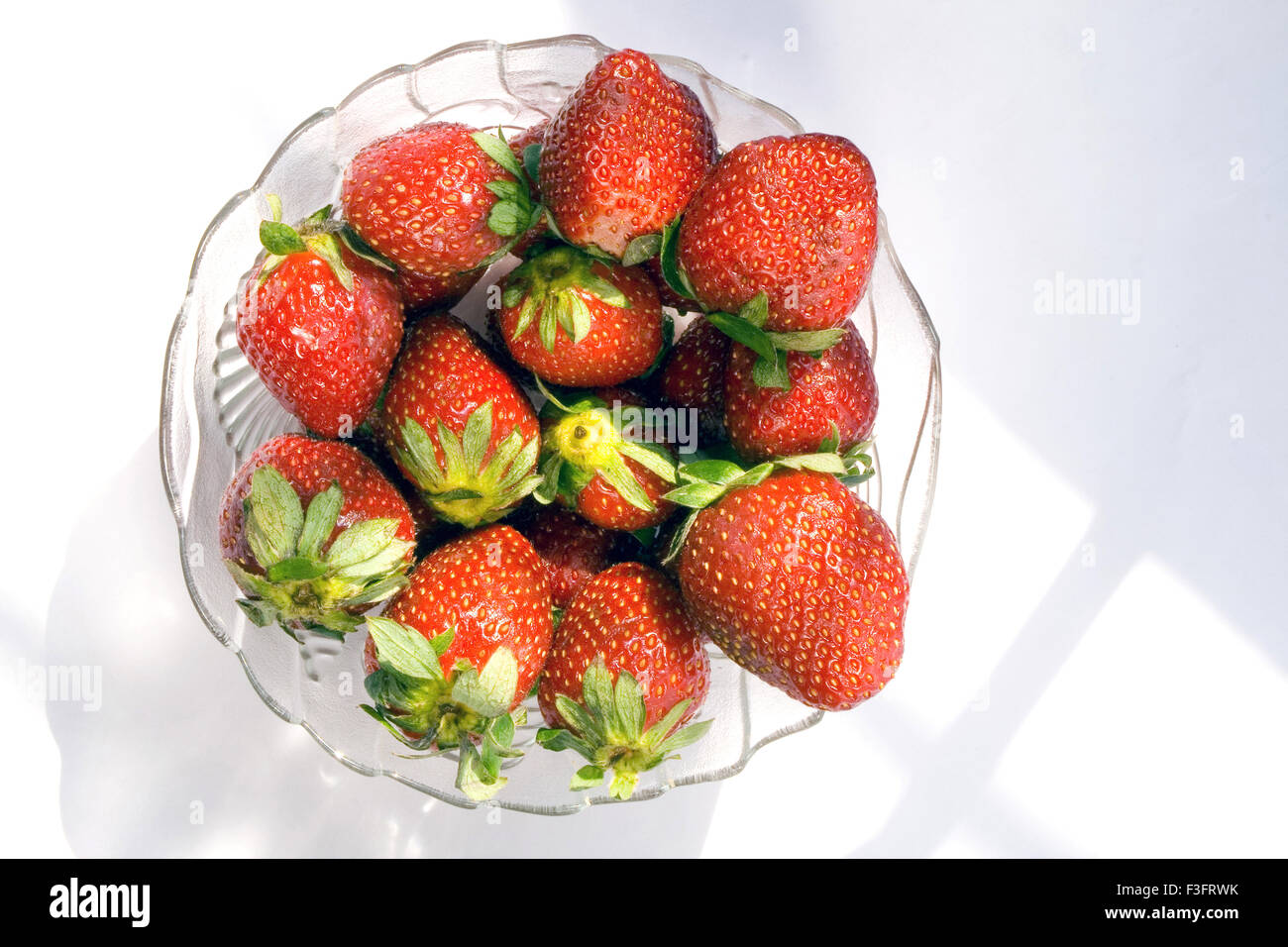 Strawberry in bowls on white background Stock Photo