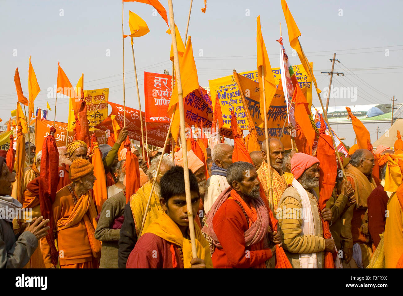 Hindu in rally with most powerful flag symbol ; Kumbh mela ; Allahabad ; Uttar Pradesh ; India Stock Photo