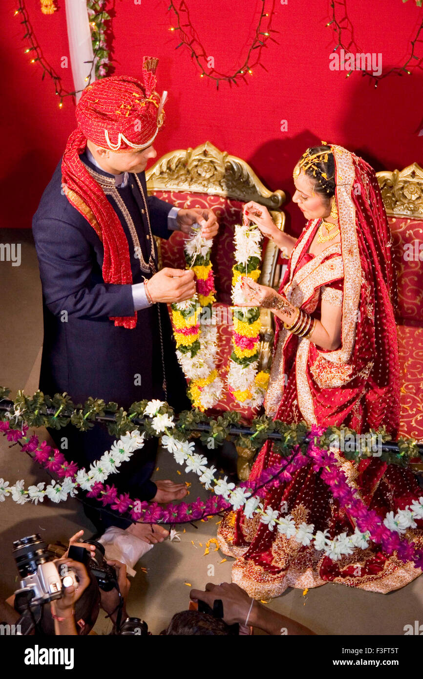 Indian bride and bridegroom exchanging garland in marriage ceremony MR Bridegroom729E; NO MR