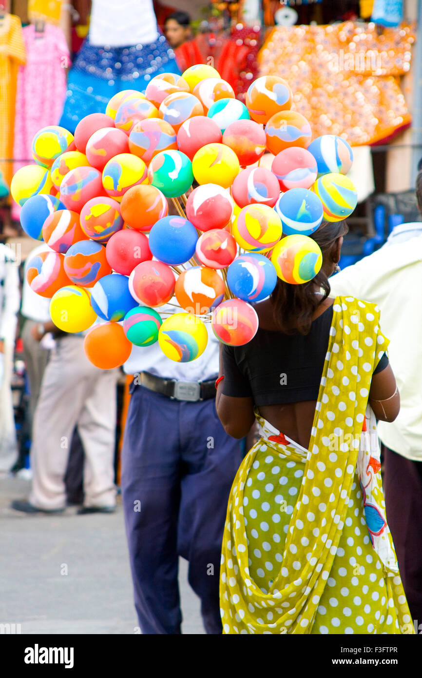 Woman selling balloons ; India Stock Photo Alamy