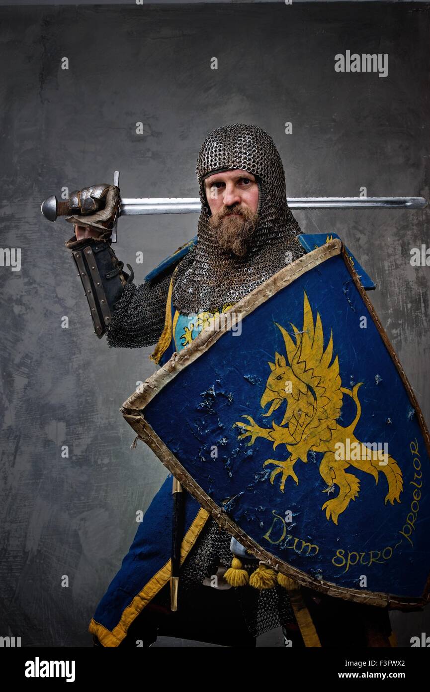 Medieval knight on grey background. Stock Photo