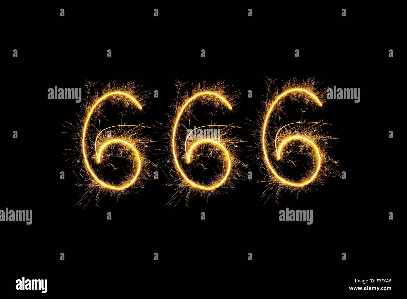 Sparkling digits 666 isolated on black background. Hell, death and satan symbol. Stock Photo