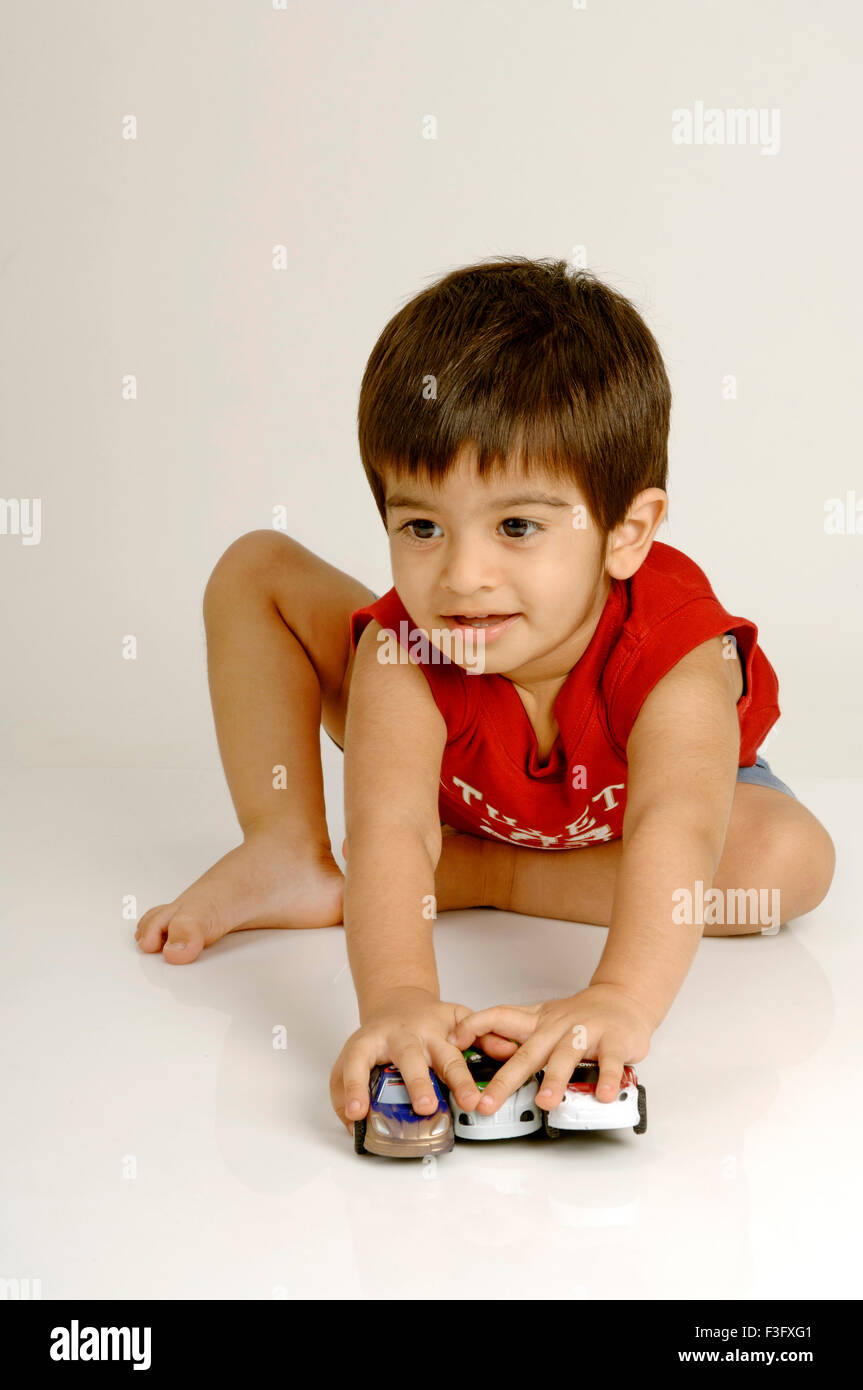 Boy playing with toy cars ; MR Stock Photo - Alamy