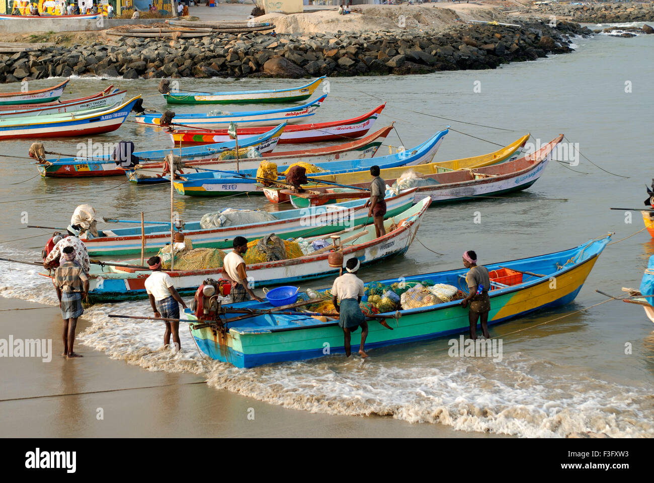 Fishing boats and fishermen ; Kanyakumari ; Tamil Nadu ; India Stock