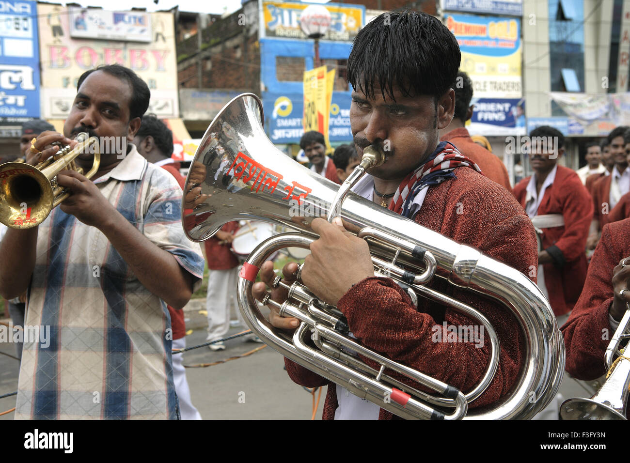 Janmashtami festival Lord Krishna birthday celebration carnival procession musical band musician playing bass tuba Jabalpur Stock Photo