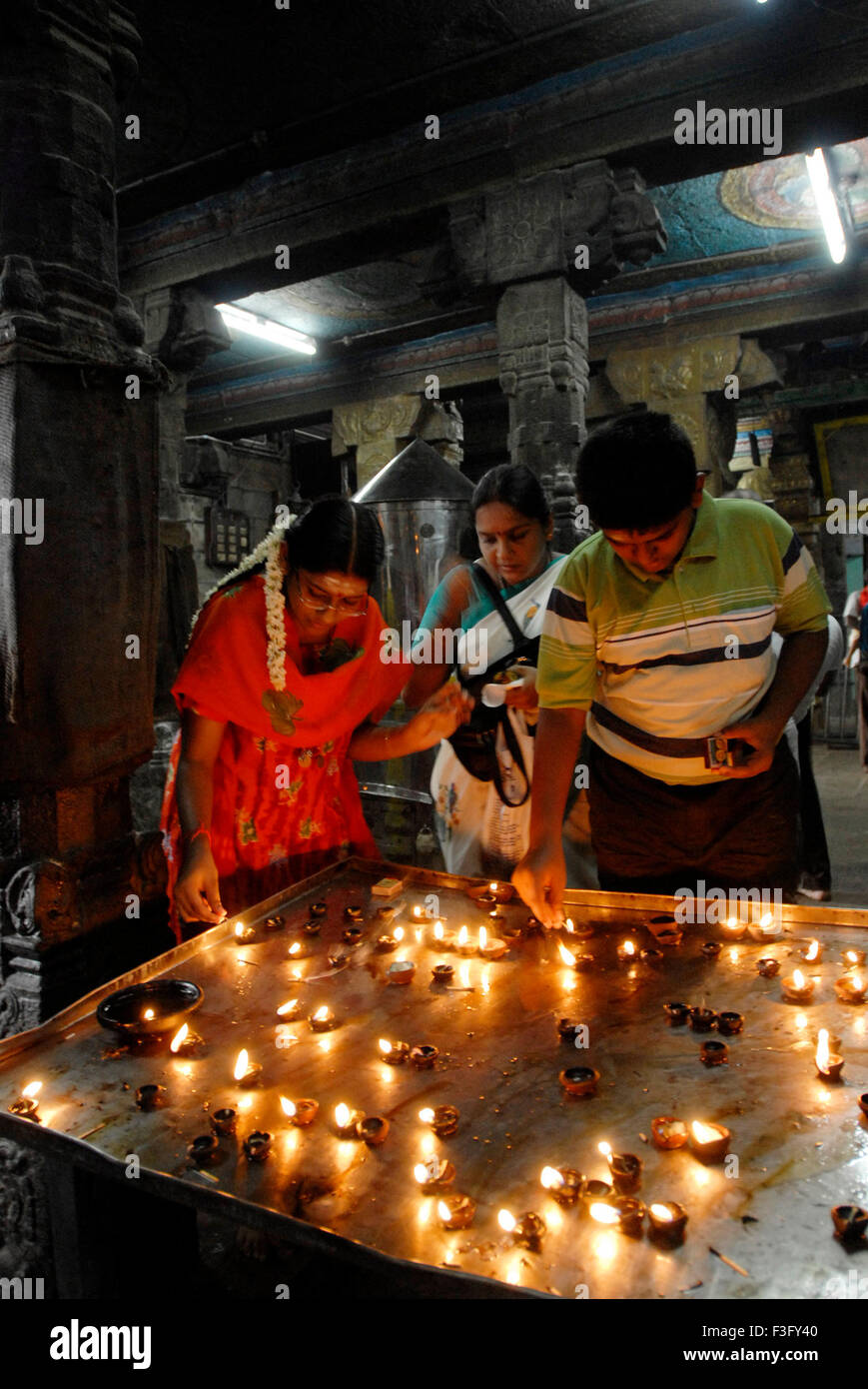 Lighting oil lamp, Arulmigu Swaminatha Swamy Temple, Swamimalai, Kumbakonam, Tanjore, Thanjavur, Tamil Nadu, India, Asia Stock Photo