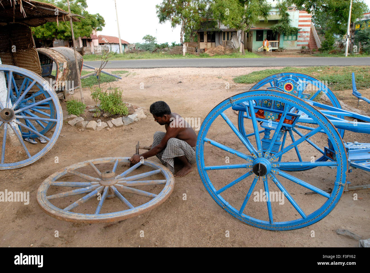Carpenter shaping bullock cart wheel, Kerala, India, Asia Stock Photo