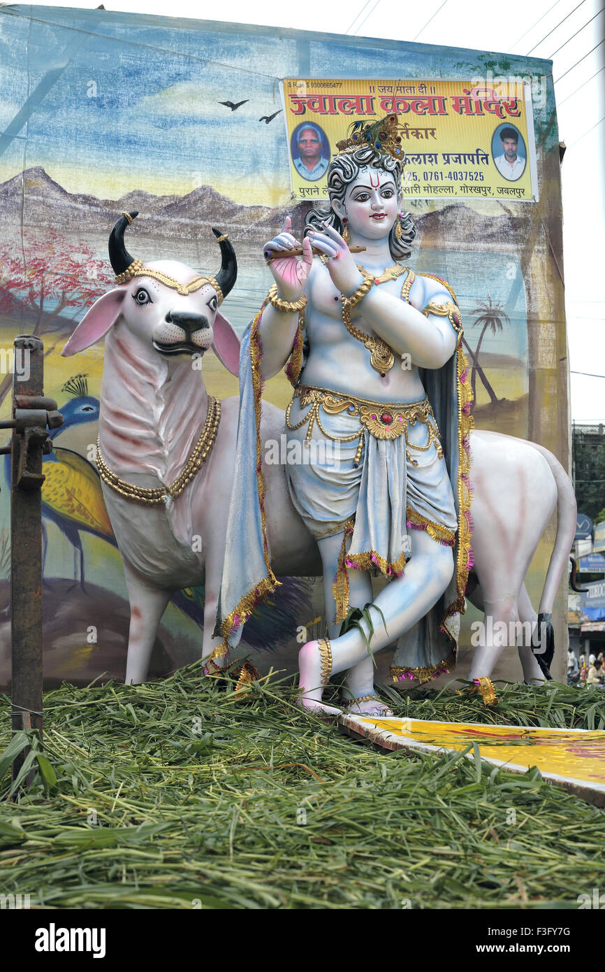 Janmashtami festival Lord Krishna birthday celebration carnival procession clay idols of Krishna cow displayed truck Jabalpur Stock Photo
