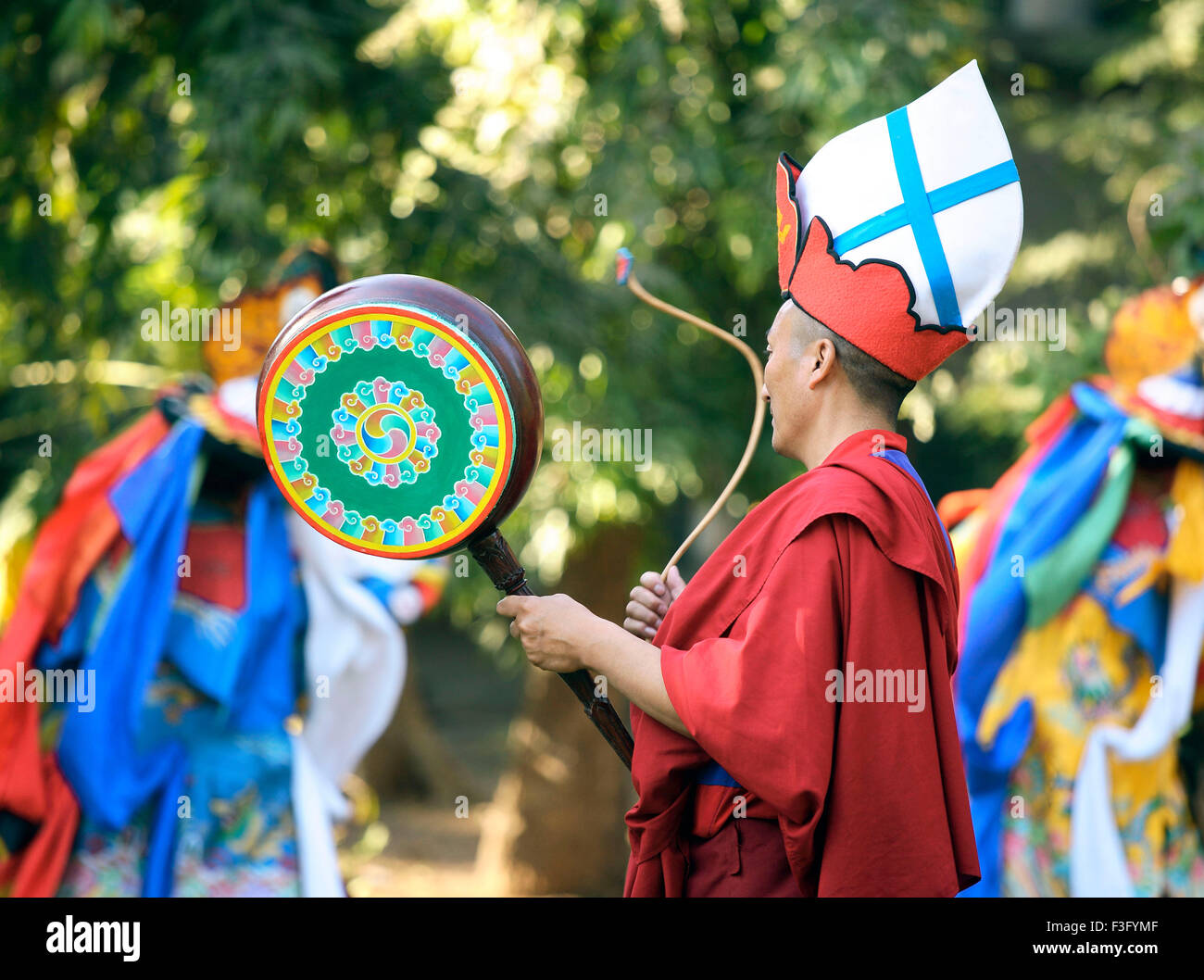 Tibetan dance, cham dance, Buddhist monks musicians playing musical instruments, mask dancers, dancing, India, Asia Stock Photo