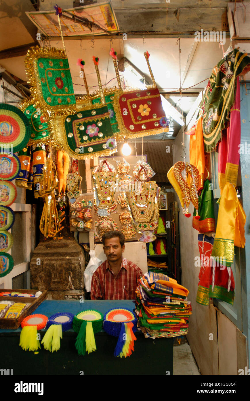 Man running shop at Pudumandapa the 328 feet (30m) long hall built by Tirumalai Nayaka in 1635 ; Madurai ; Tamil Nadu ; India Stock Photo