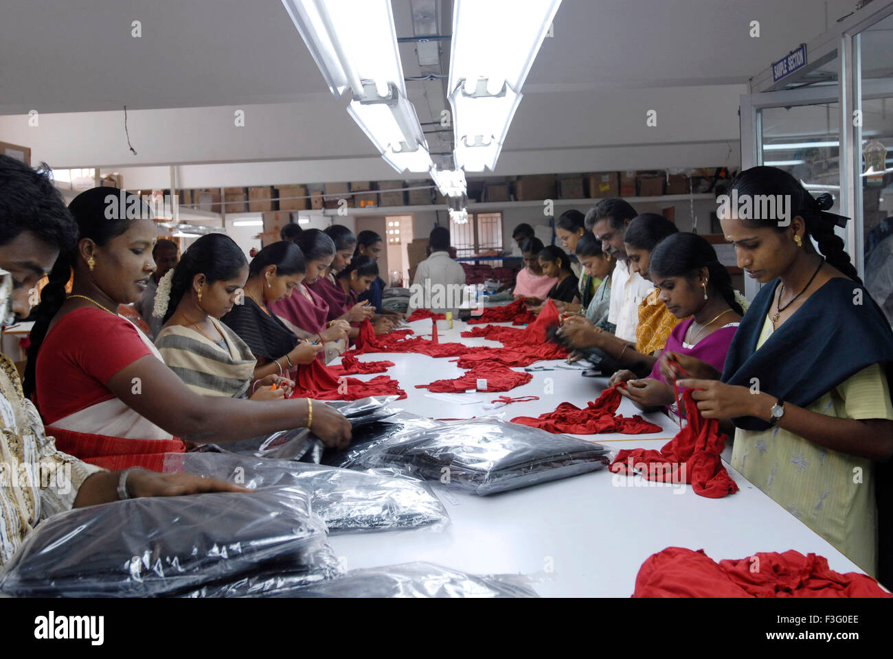 Garments packing in a garment industry ; Tirupur ; Tamil Nadu ; India ...