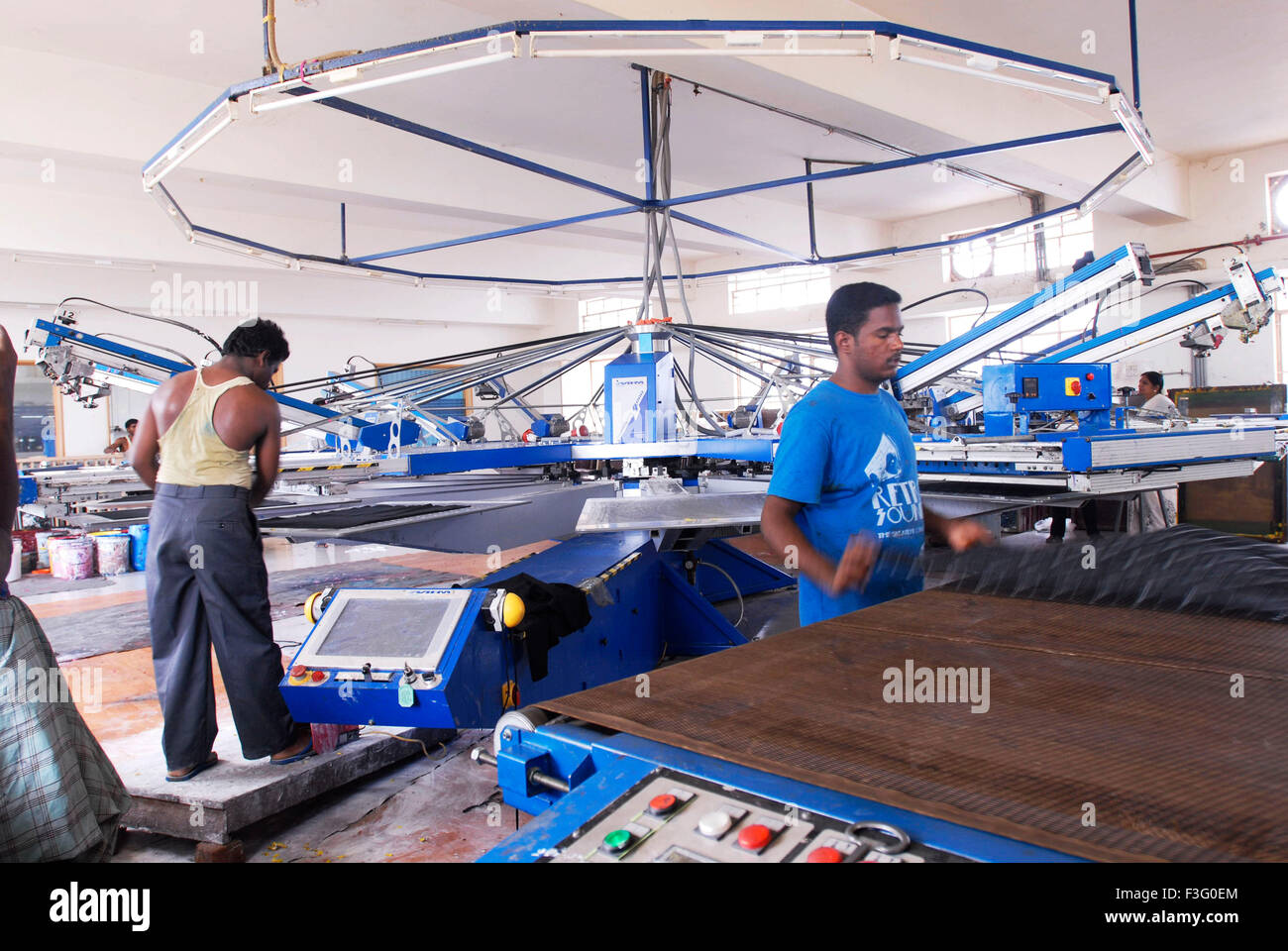 Automatic fabric screen printing machine in a garment industry ; Tirupur ; Tamil Nadu ; India Stock Photo