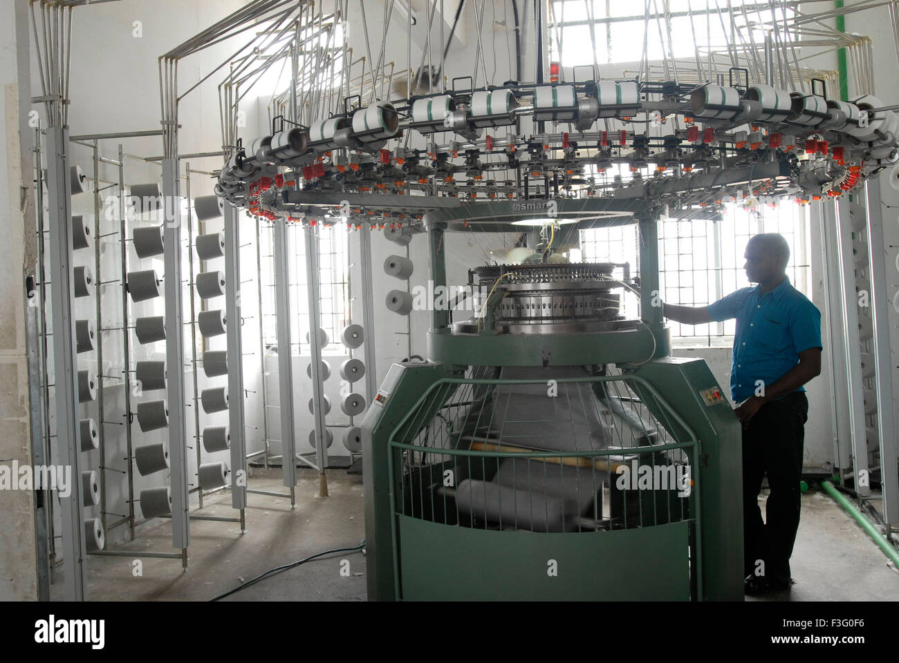 Knitting in a garment industry ; Tirupur ; Tamil Nadu ; India Stock
