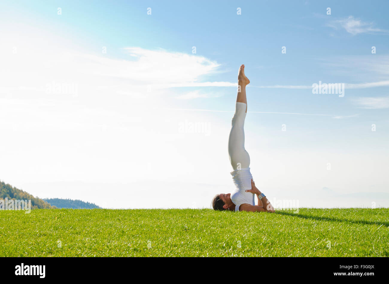 Shoulderstand sarvangasana woman yoga hi-res stock photography and images -  Alamy