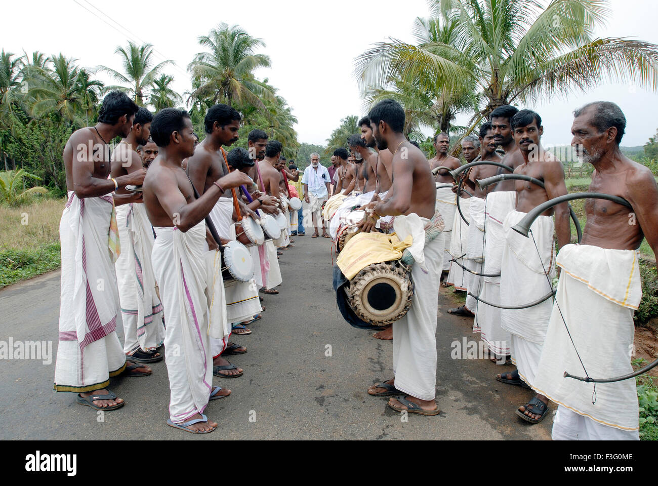 Musicians playing for temple festival ; Kerala ; India Stock Photo