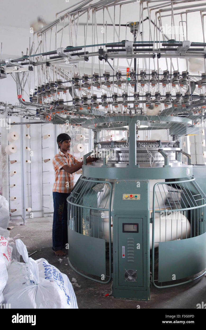 Knitting in a garment industry ; Tirupur ; Tamil Nadu ; India Stock