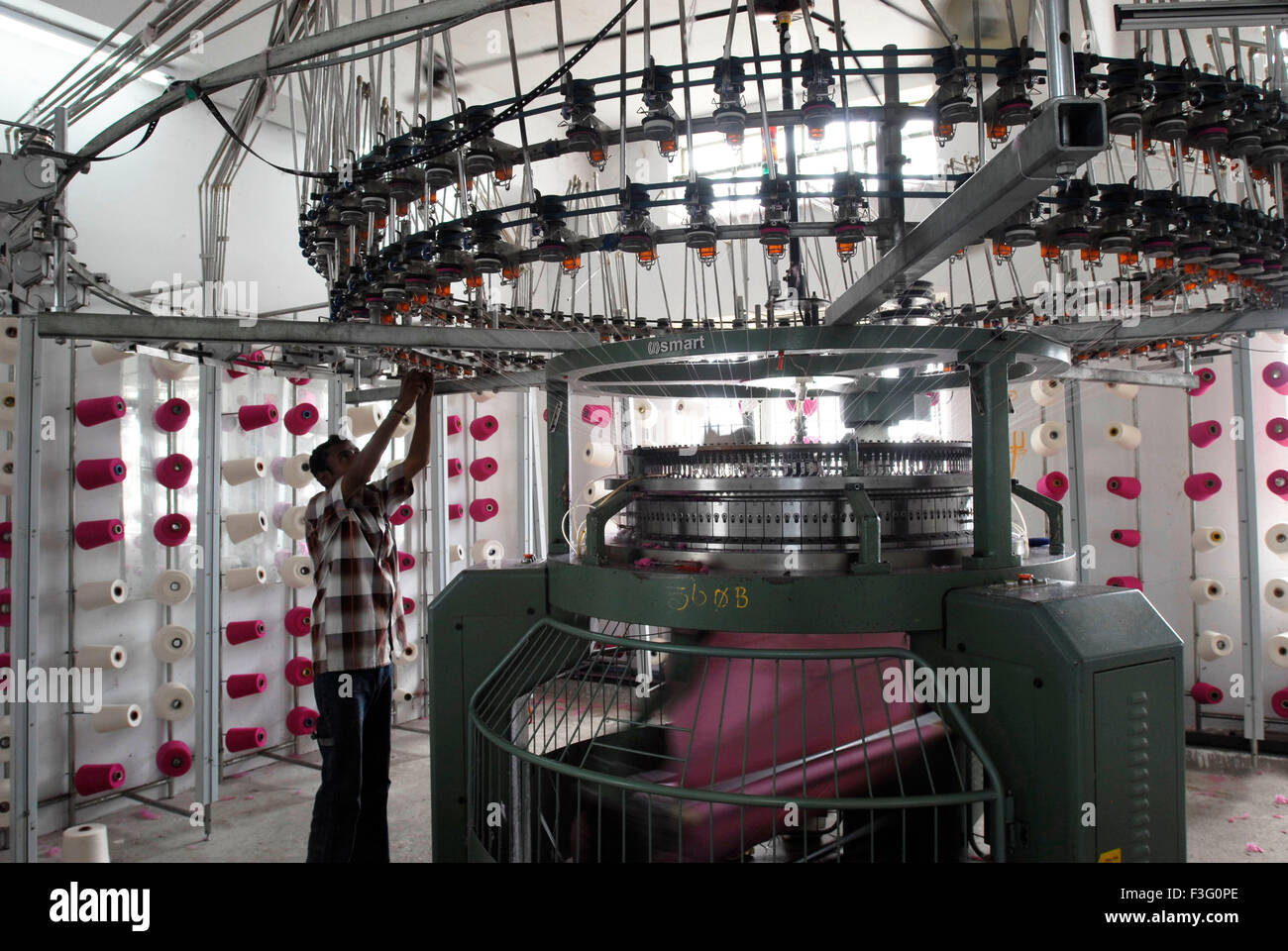Knitting in a garment industry ; Tirupur ; Tamil Nadu ; India Stock