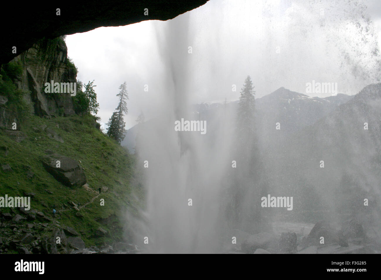 Jogini waterfall view from cave inset ; Nehru kund ; Manali ; Himachal Pradesh ; India Stock Photo