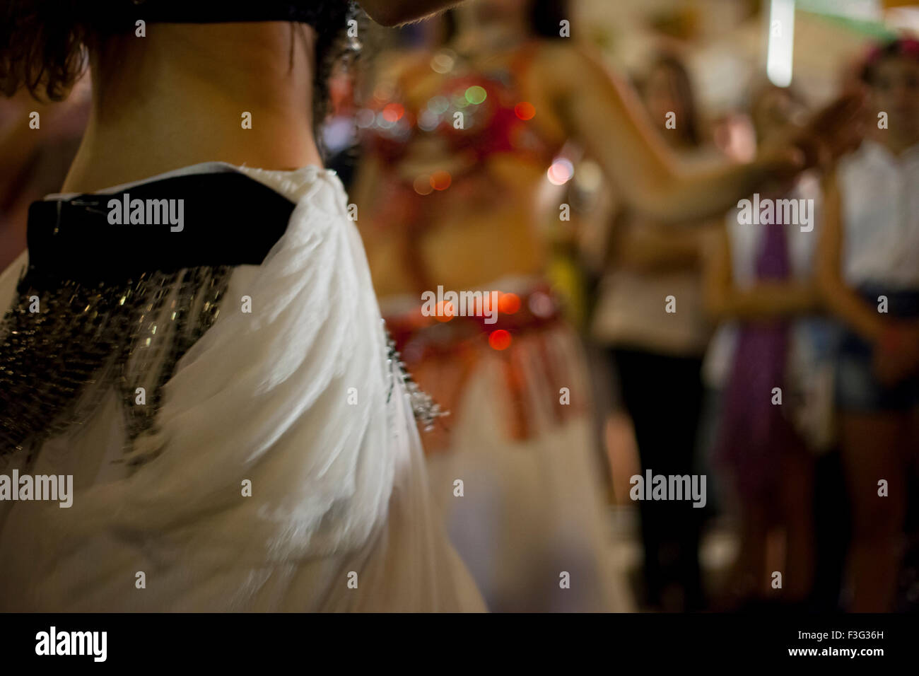 Belly dancers detail dancing with arabic music street band at the