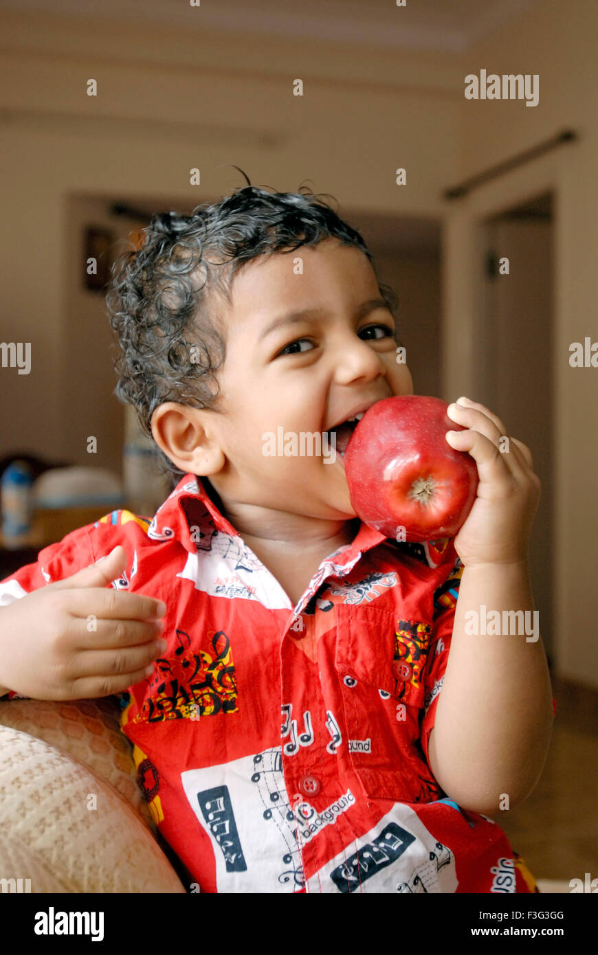 boy eating apple MR#7 MR#777I Stock Photo