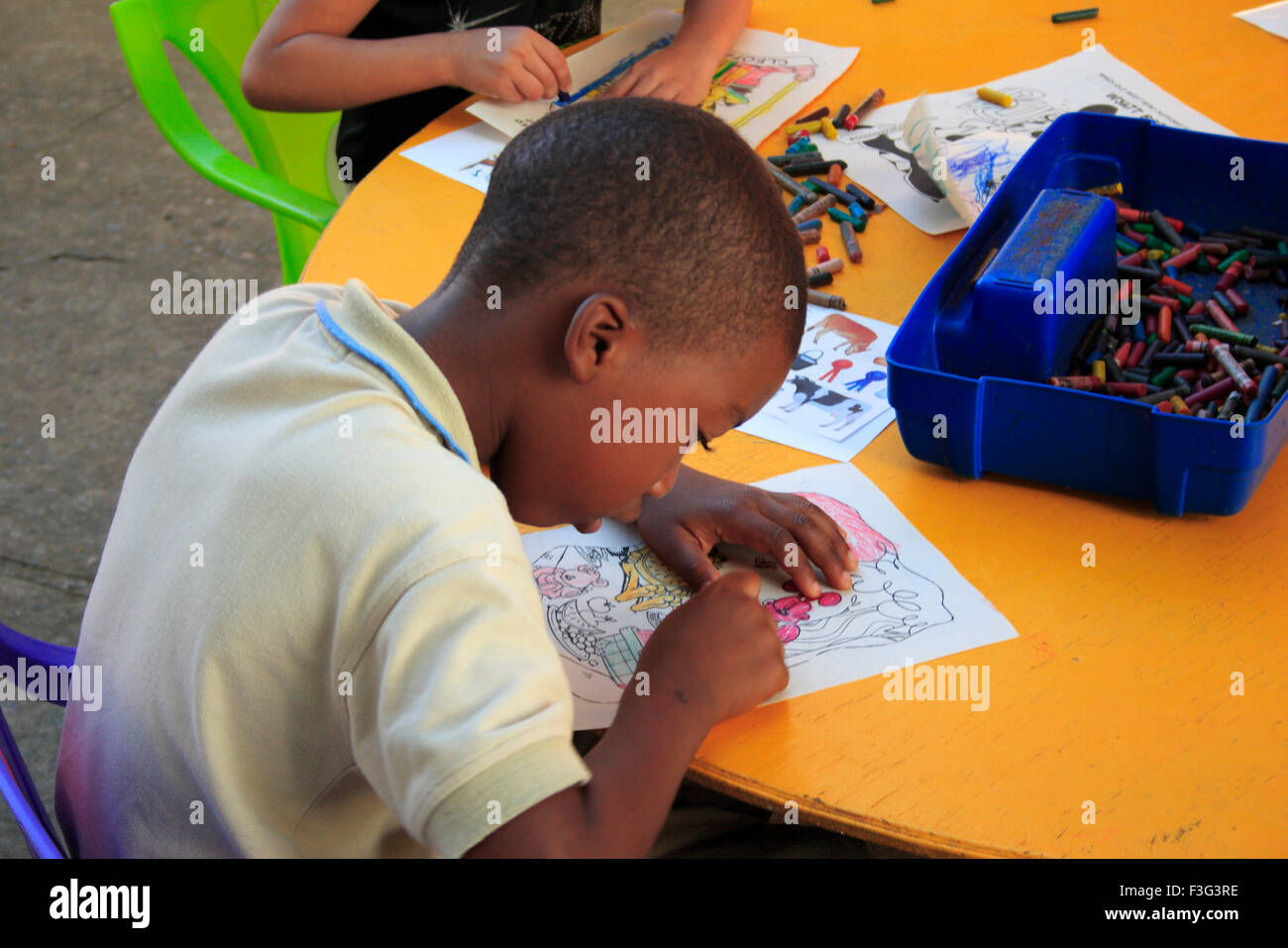 A child making drawing ; Roatan island ; country Honduras Stock Photo