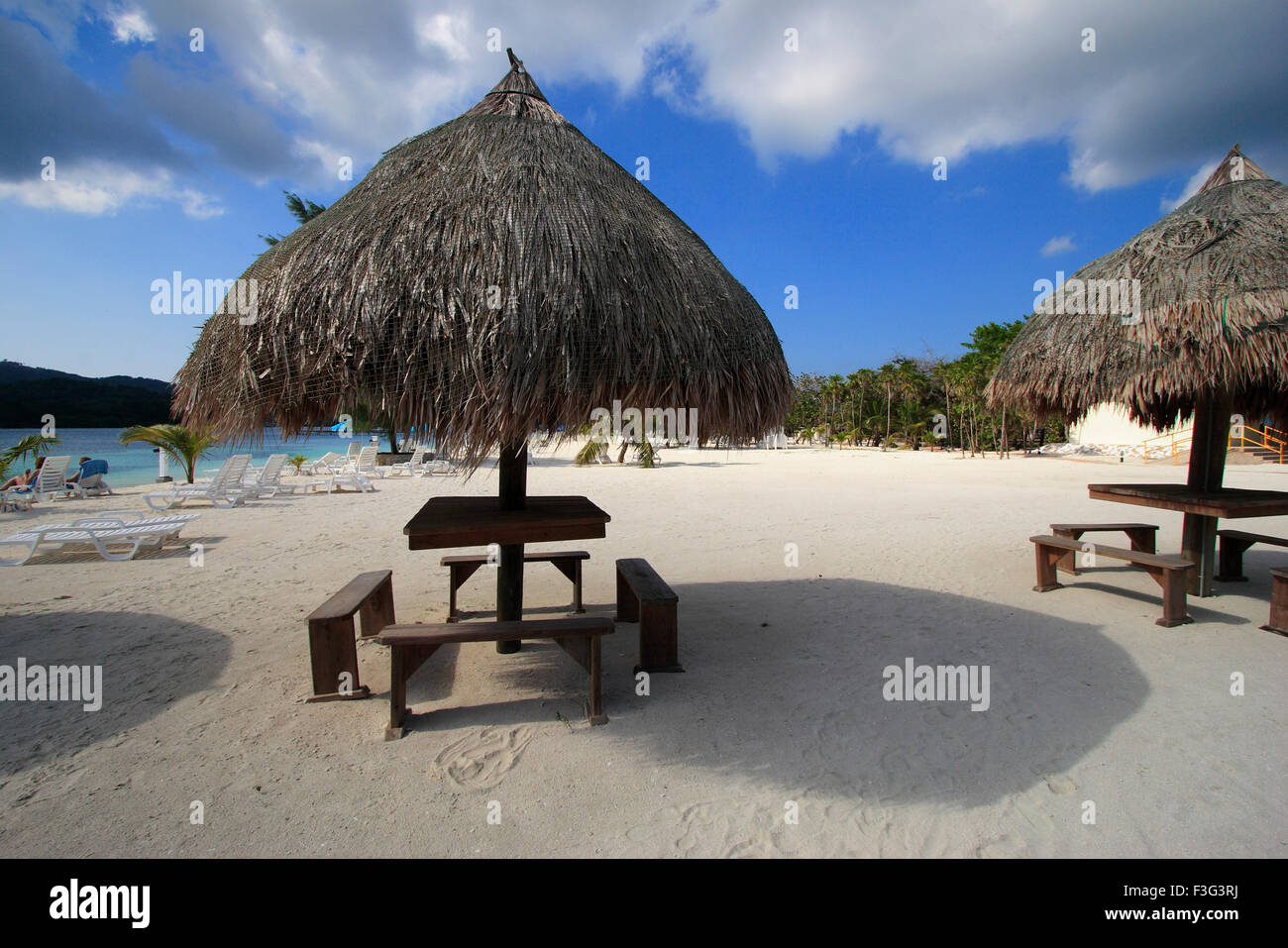 Beach umbrella with chairs, Roatan Island, Ruatan, Rattan, Honduras, Caribbean, Central America Stock Photo