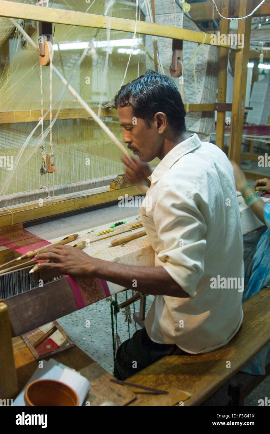 Weaver weaving silk handloom ; Kanchipuram ; Tamilnadu ; India Stock