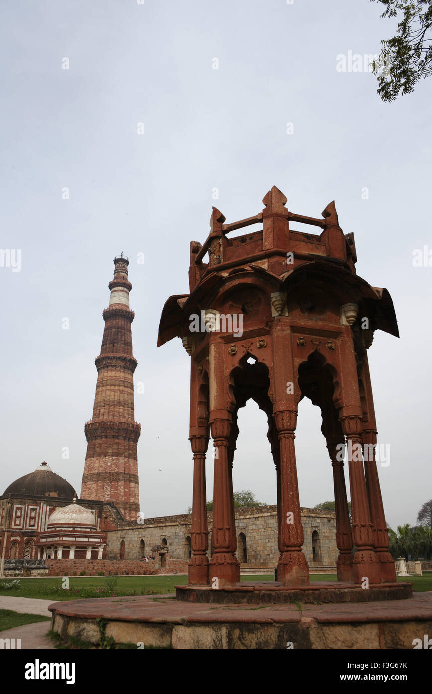 Smith's folly and Qutb Minar built in 1311 red sandstone tower ; Indo Muslim art ; Delhi Stock Photo