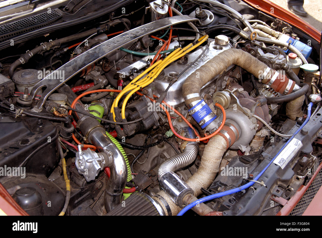 Close ups of Honda engine fitted in Maruti Suzuki car ; Maharashtra ; India Stock Photo