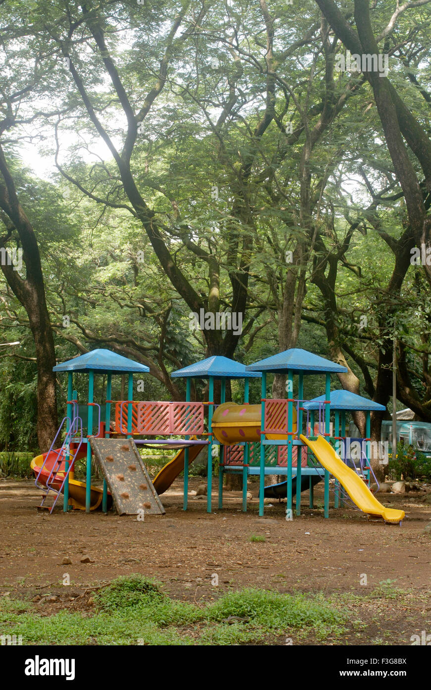 Various types colourful slides play tool children fitted dense forest Sanjay Gandhi National Park Borivali Mumbai Stock Photo